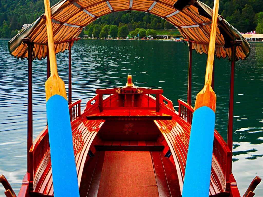 Red Boat on Body of Water